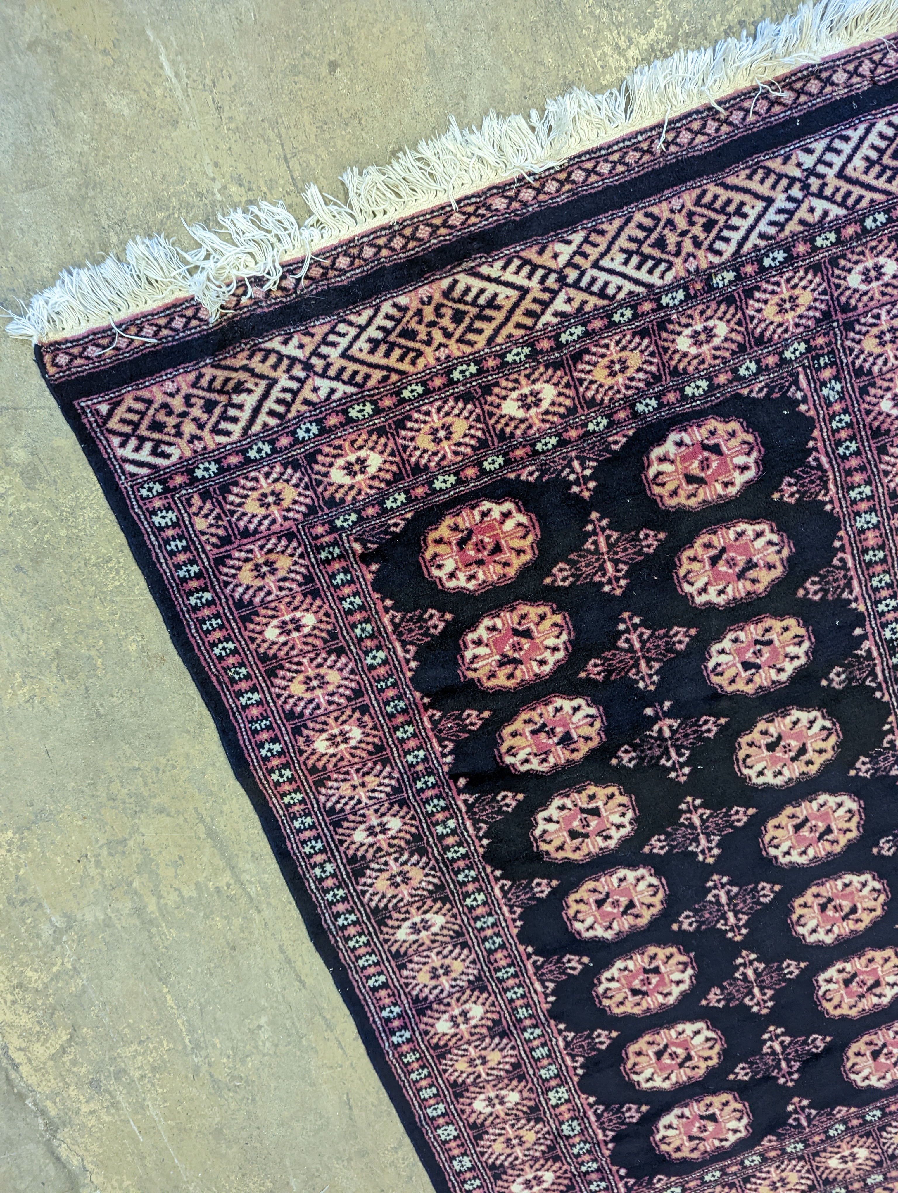 A Bokhara design blue ground rug, 160 x 98cm